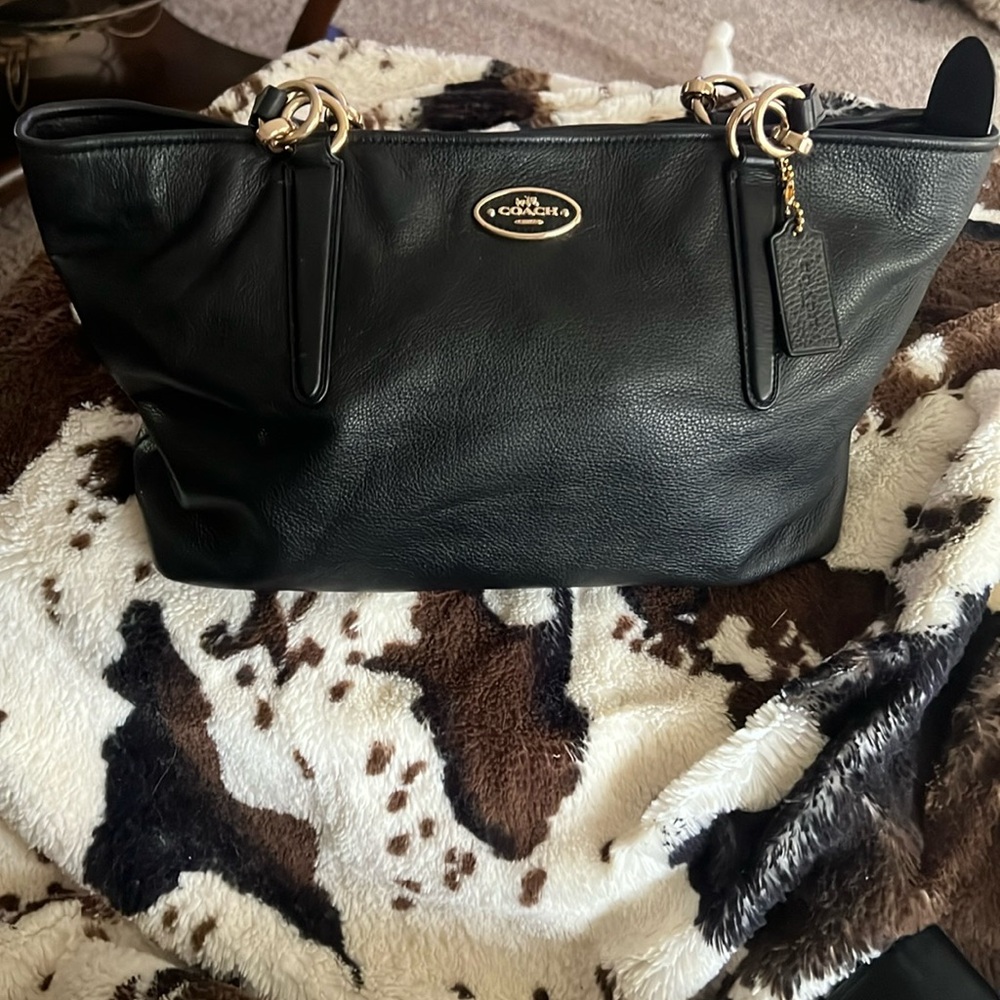 Coach black leather satchel. Lightly used. Excellent condition.